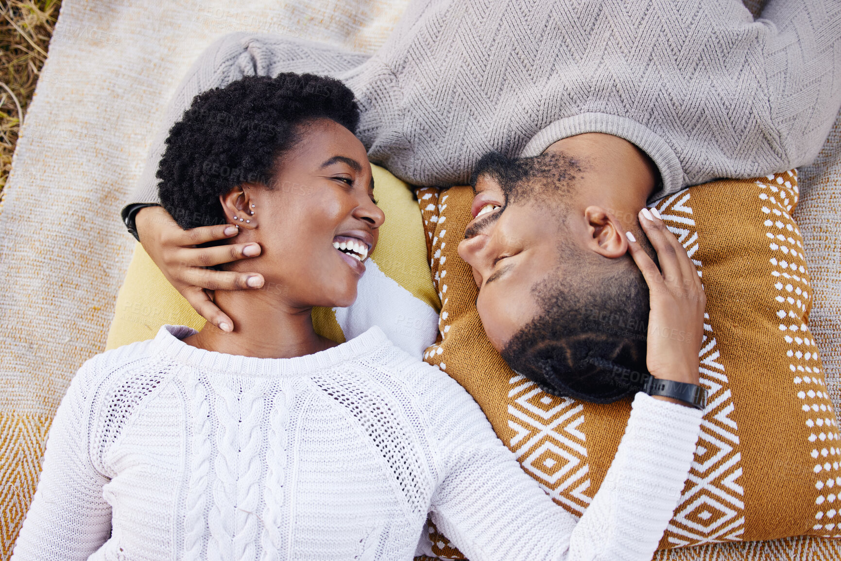 Buy stock photo Picnic, above and happy black couple at park for anniversary date or honeymoon romance with smile. Wellness, touching and African people in nature with support, care and love on holiday fun in garden