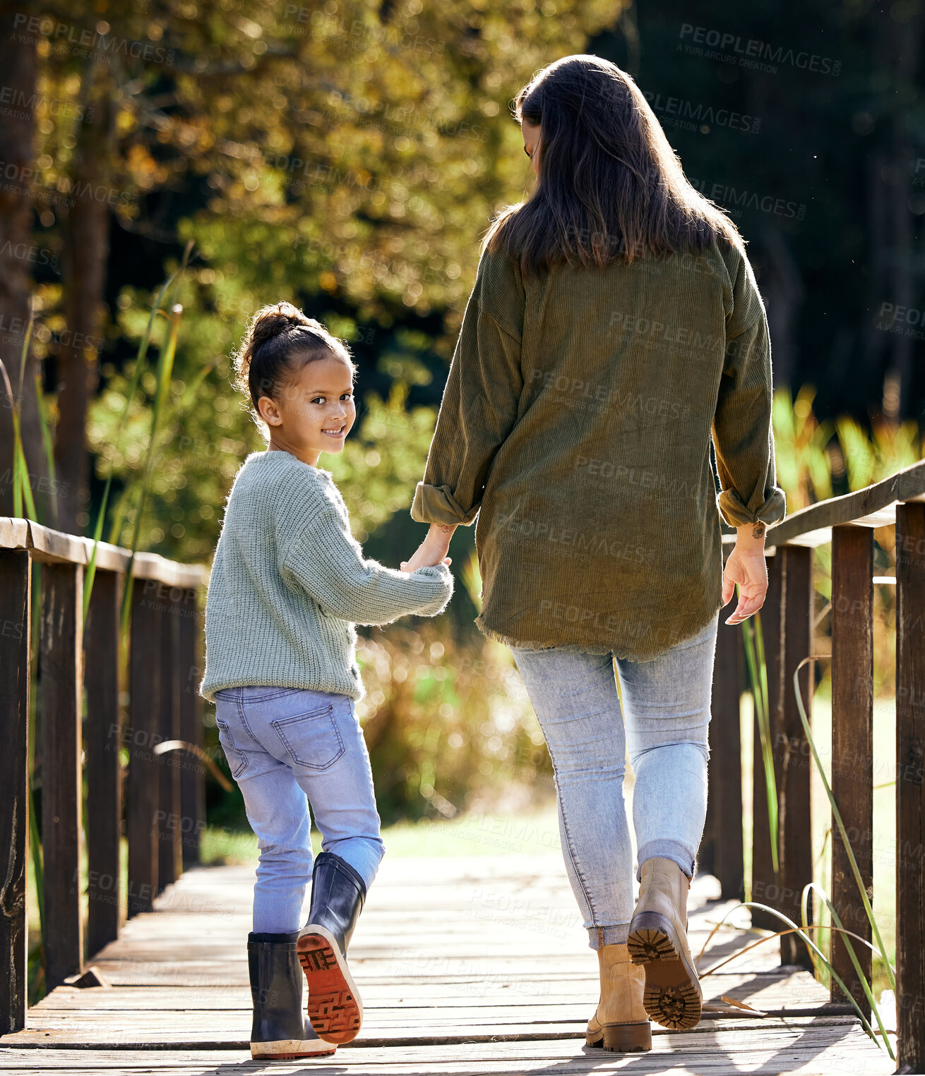 Buy stock photo Portrait, young girl and mother hand holding on walk outdoor in park for bonding, relationship and love. Family, woman and daughter together in nature happy for support, development and traveling