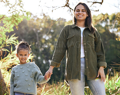 Buy stock photo Portrait, girl and mother hand holding on walk outdoor in park for bonding, relationship and love. Family, woman and daughter together in nature happy for support, development and summer traveling