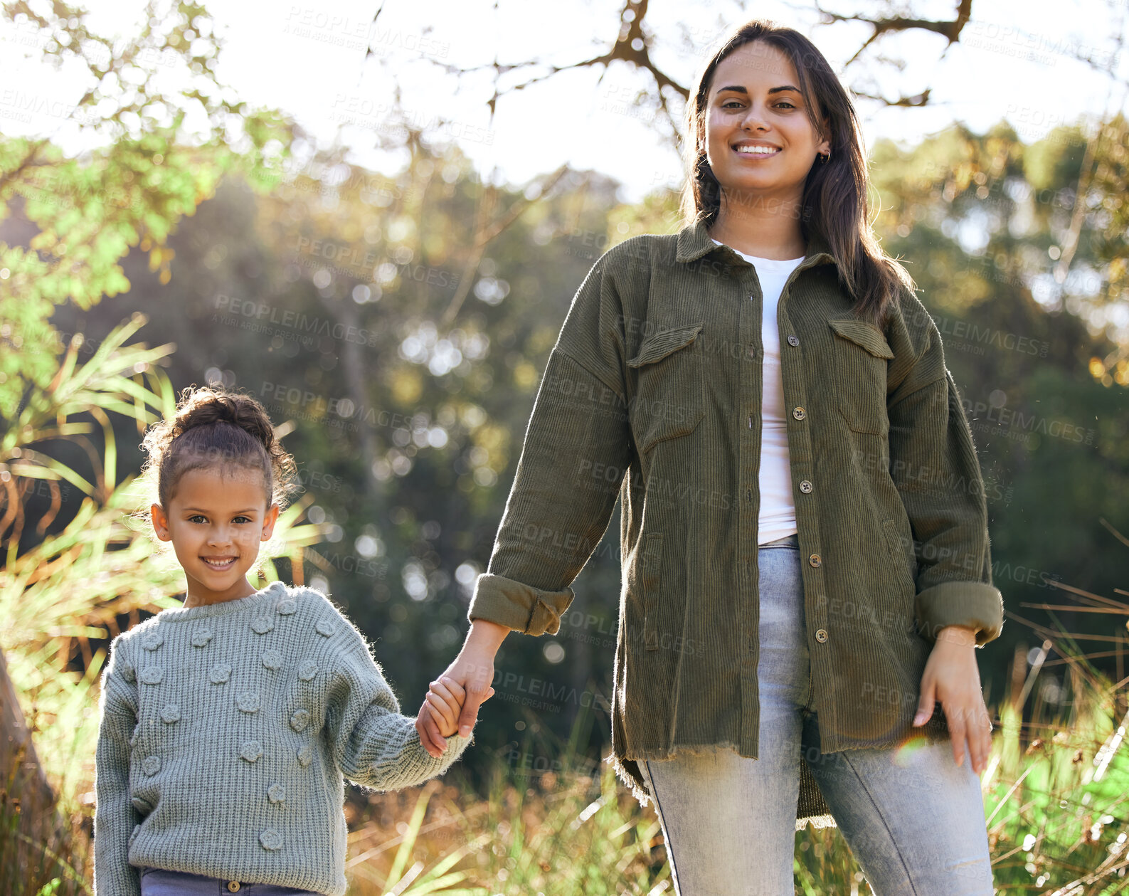 Buy stock photo Portrait, girl and mother hand holding on walk outdoor in park for bonding, relationship and love. Family, woman and daughter together in nature happy for support, development and summer traveling