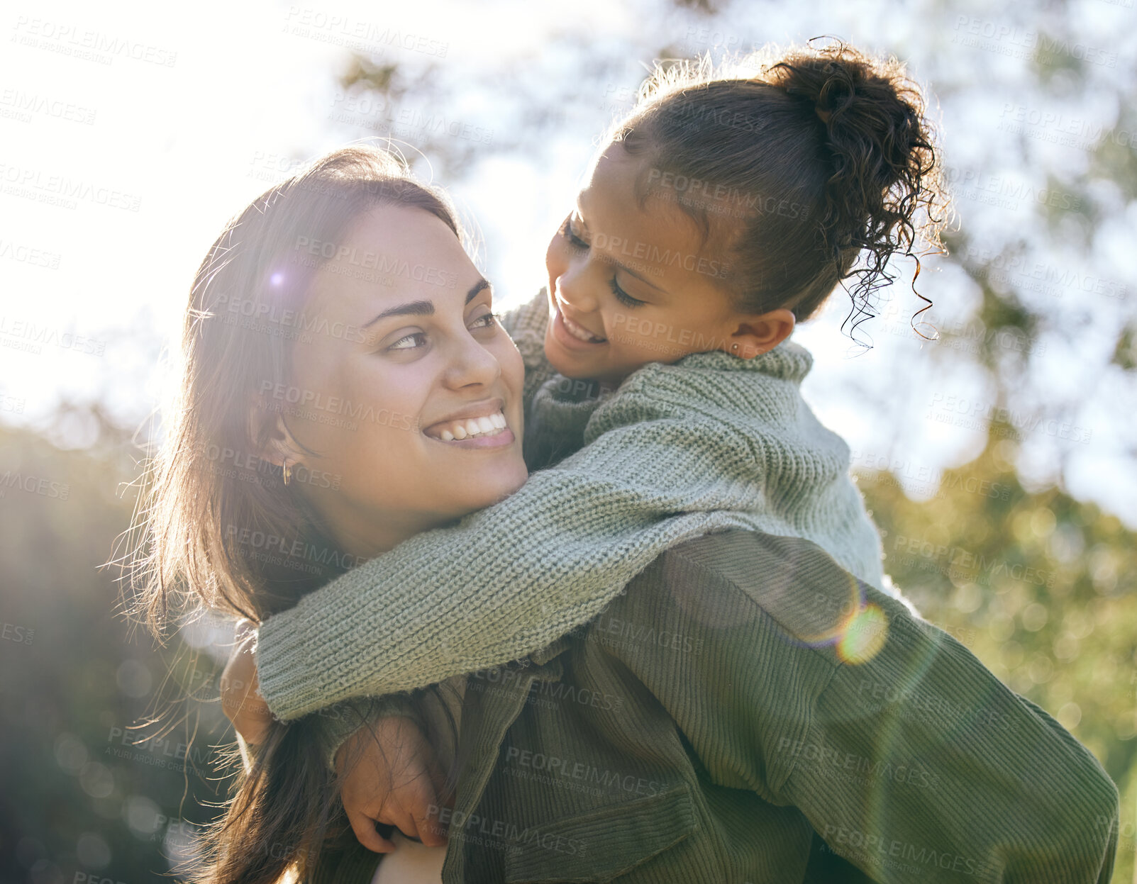 Buy stock photo Happy, piggyback and a mother and child in a park for playing, bonding and quality time. Smile, hug and a young mom with a girl kid in nature with love, care and happiness on mothers day together