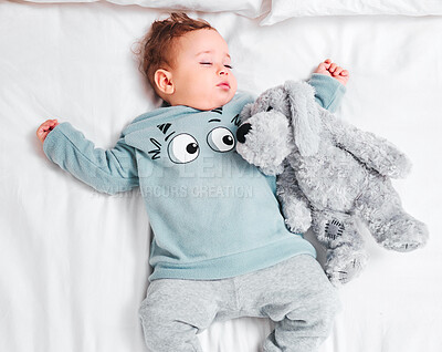 Buy stock photo Relax, sleeping and baby with teddy bear on bed in top view house for resting, dream or afternoon nap. Child development, toy and calm boy kid in a bedroom for morning routine, peace and quiet snooze