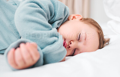 Buy stock photo Peace, calm and baby boy on bed for sleeping, dreaming and resting in his home for quiet, nap or routine. Face, relax and kid asleep in a bedroom with safety, comfort and child development in a house