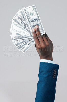 Buy stock photo Corporate, money fan and hand in studio for profit, interest and investment on gray background. Black businessman, US dollars and cash in fingers for payment, budget and success in enterprise