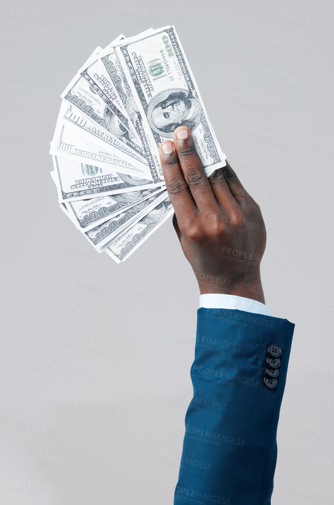 Buy stock photo Corporate, money fan and hand in studio for profit, interest and investment on gray background. Black businessman, US dollars and cash in fingers for payment, budget and success in enterprise