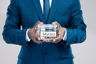 Buy stock photo Hands, black man and jar with savings for money, cash investment and budget management by studio background. African guy, businessman and container with coins for financial security and pension fund