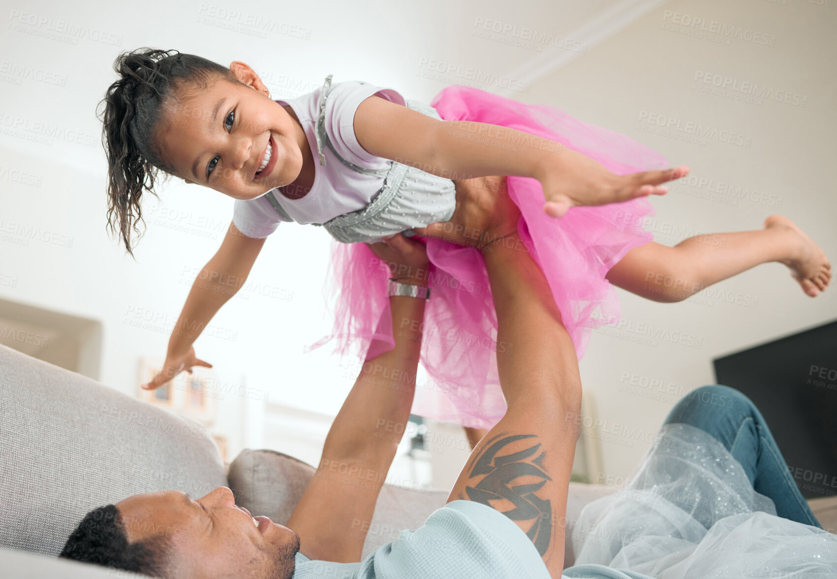 Buy stock photo Child, father and airplane on sofa for portrait, fun and bonding in childhood in living room. Happy girl, dad and fantasy at home for flying, support and excited on couch for family games in lounge