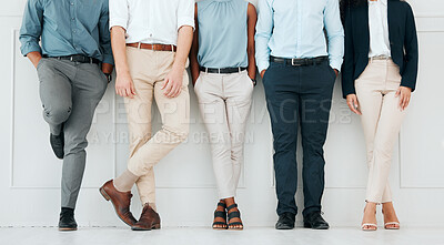 Buy stock photo Shot of a group of unrecognizable businesspeople standing in a line at work