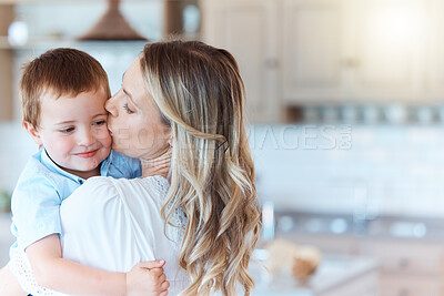 Buy stock photo Shot of a mother carrying her son in the lounge at home