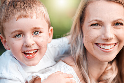 Buy stock photo Shot of a young mother and son spending time together at a park