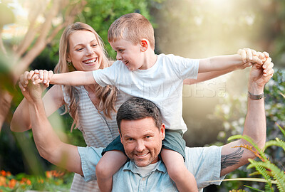 Buy stock photo Shot of a young family enjoying a day at the park