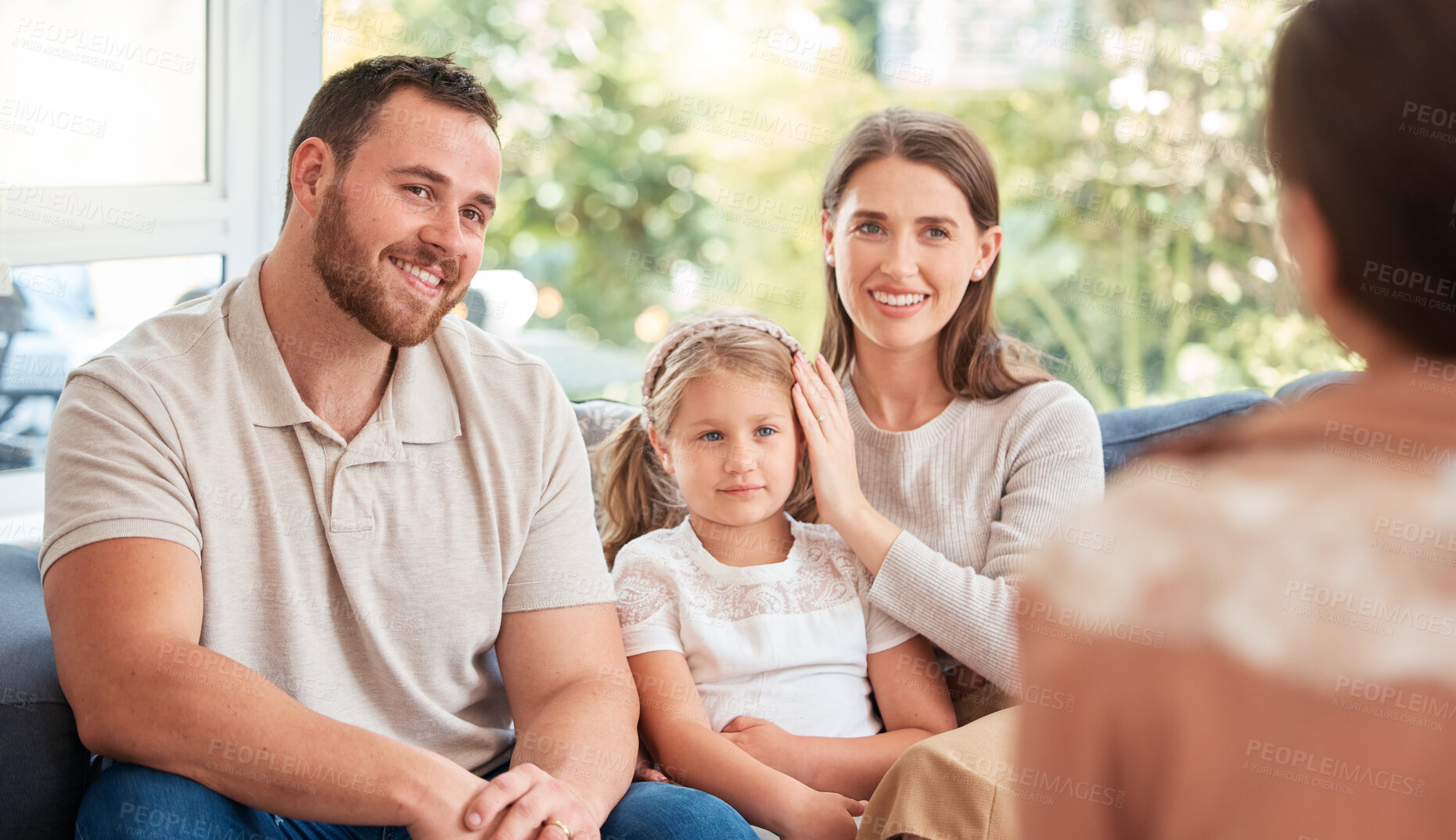 Buy stock photo Parents, kids and counselling with psychologist, smile and therapy on sofa, support and discussion. Young family, children and happy on couch with psychology, listening and talking for mental health