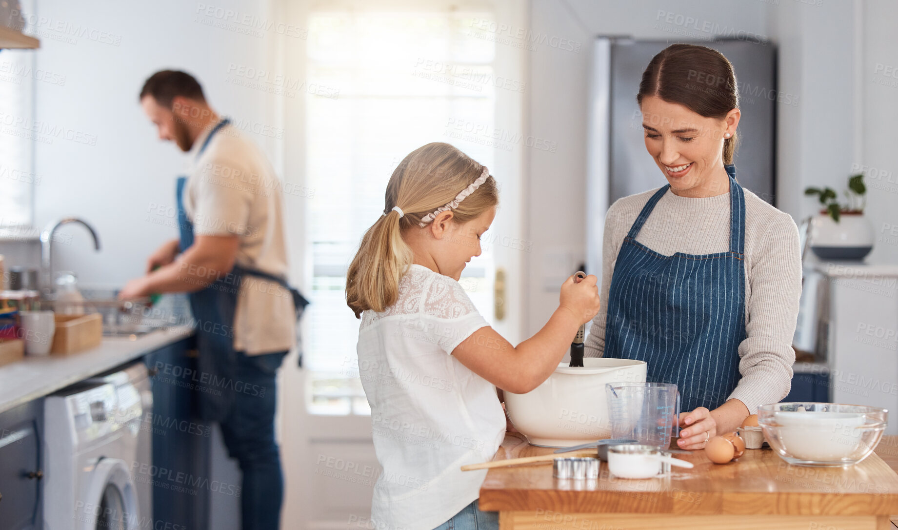 Buy stock photo Family, child and bake in home kitchen, woman and kid assisting for culinary skills or bonding together. Man, cleaning and kid development or mixing ingredients, apartment and support for love