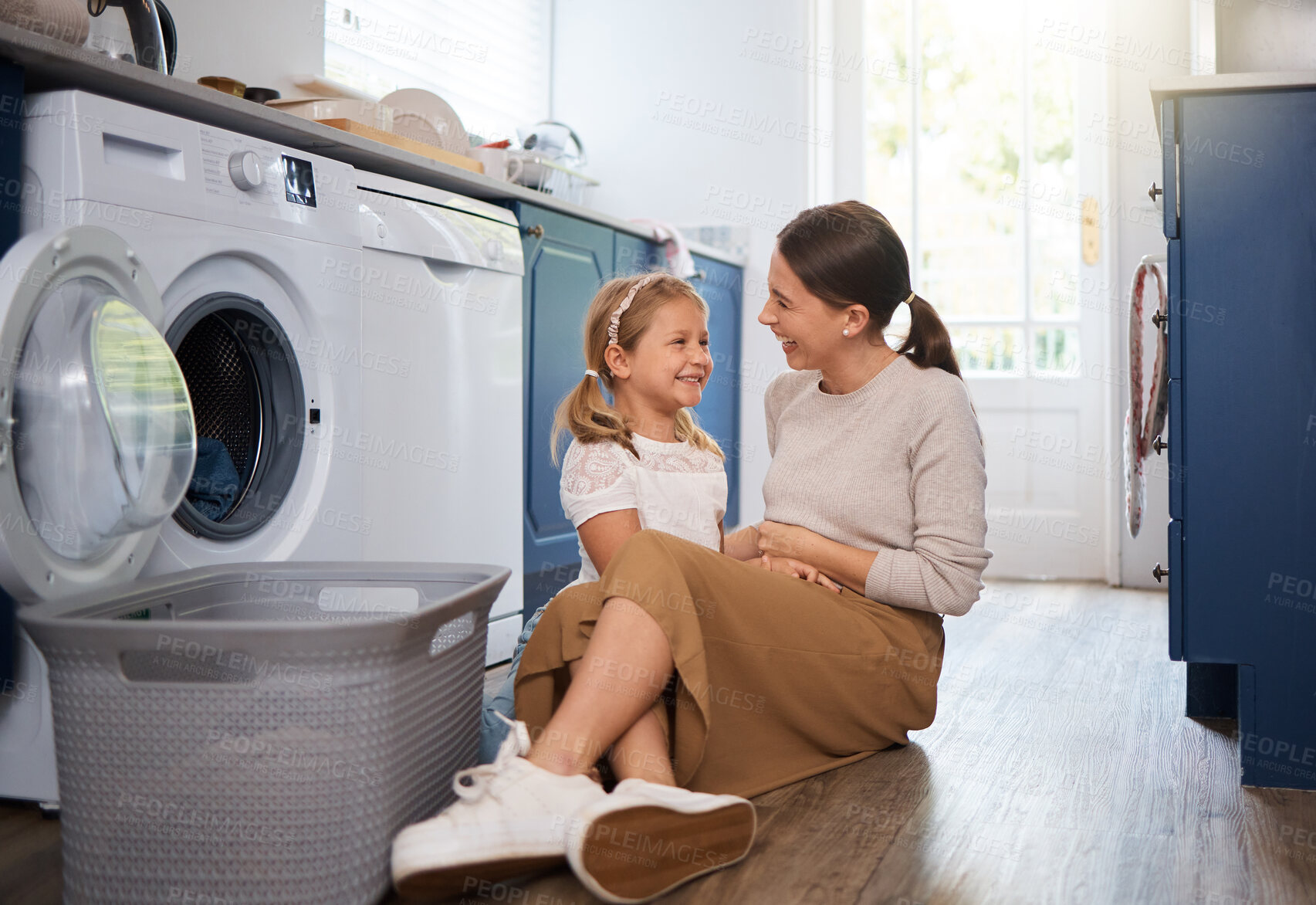 Buy stock photo Cleaning, laundry or washing machine with mother and daughter on floor in home for housekeeping. Hygiene, love or smile with woman parent and girl child in apartment together for domestic chores