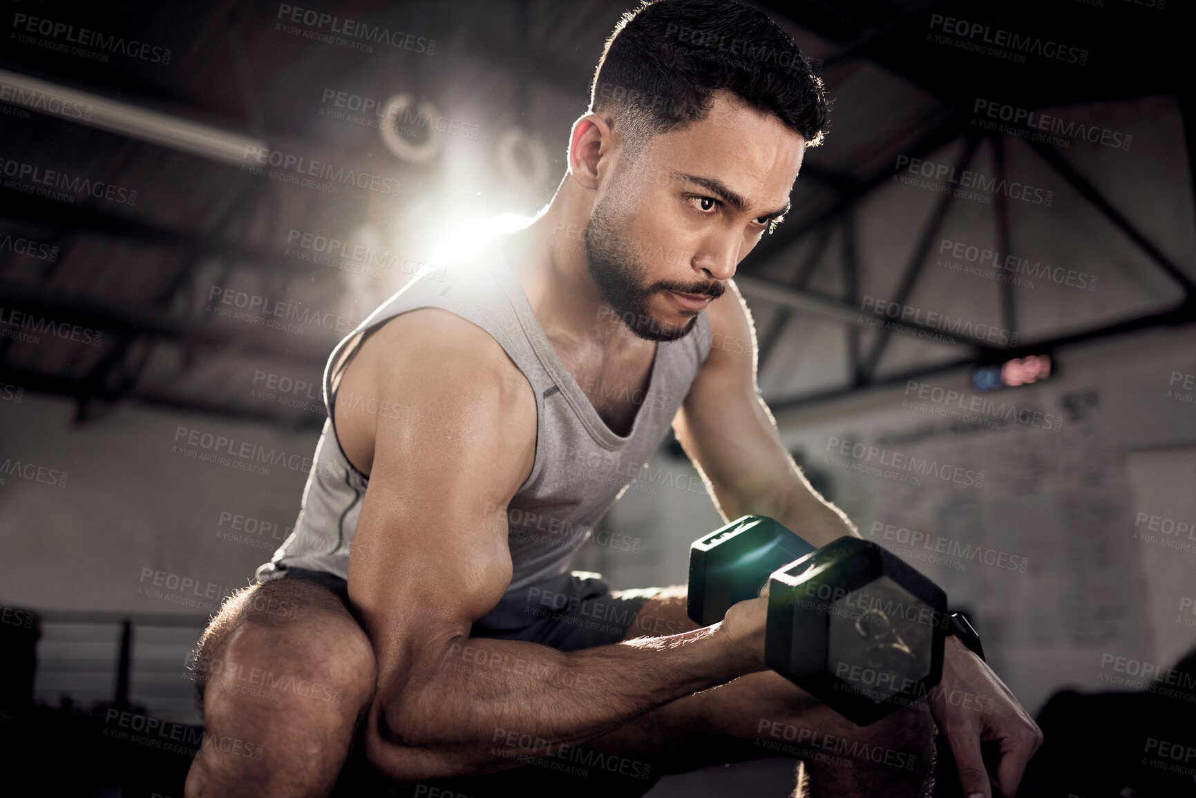 Buy stock photo Fitness, dumbbell or strong man training, exercise or workout for powerful arms or muscles at gym. Concentration curls, strength or serious Arab athlete lifting weights or exercising biceps in Dubai