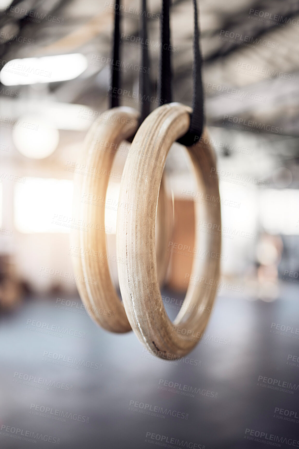 Buy stock photo Gymnastic rings, gym and workout for exercise, fitness and strong or power challenge for training. Equipment, tool and flexibility harness or sports for wellness, arena and gear for competition