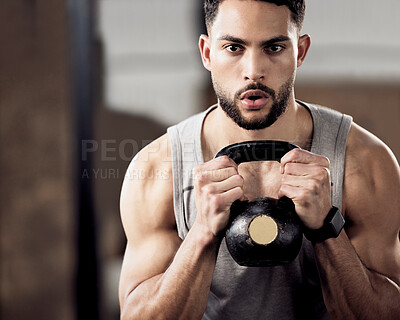Buy stock photo Shot of a young man doing squats with weights in gym