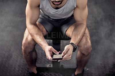 Buy stock photo Man, phone and app for workout in gym, tracking fitness and online research for exercise. Male person, above and athlete for health or wellness progress, social media and internet for conversation