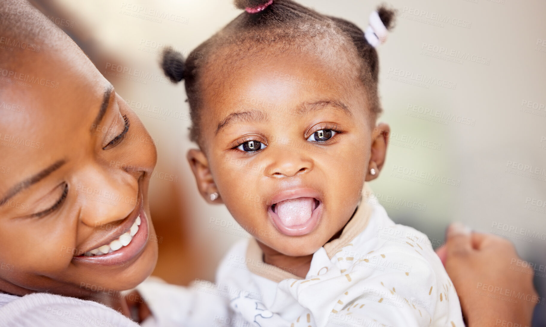 Buy stock photo Shot of a mother bonding with her baby daughter at home