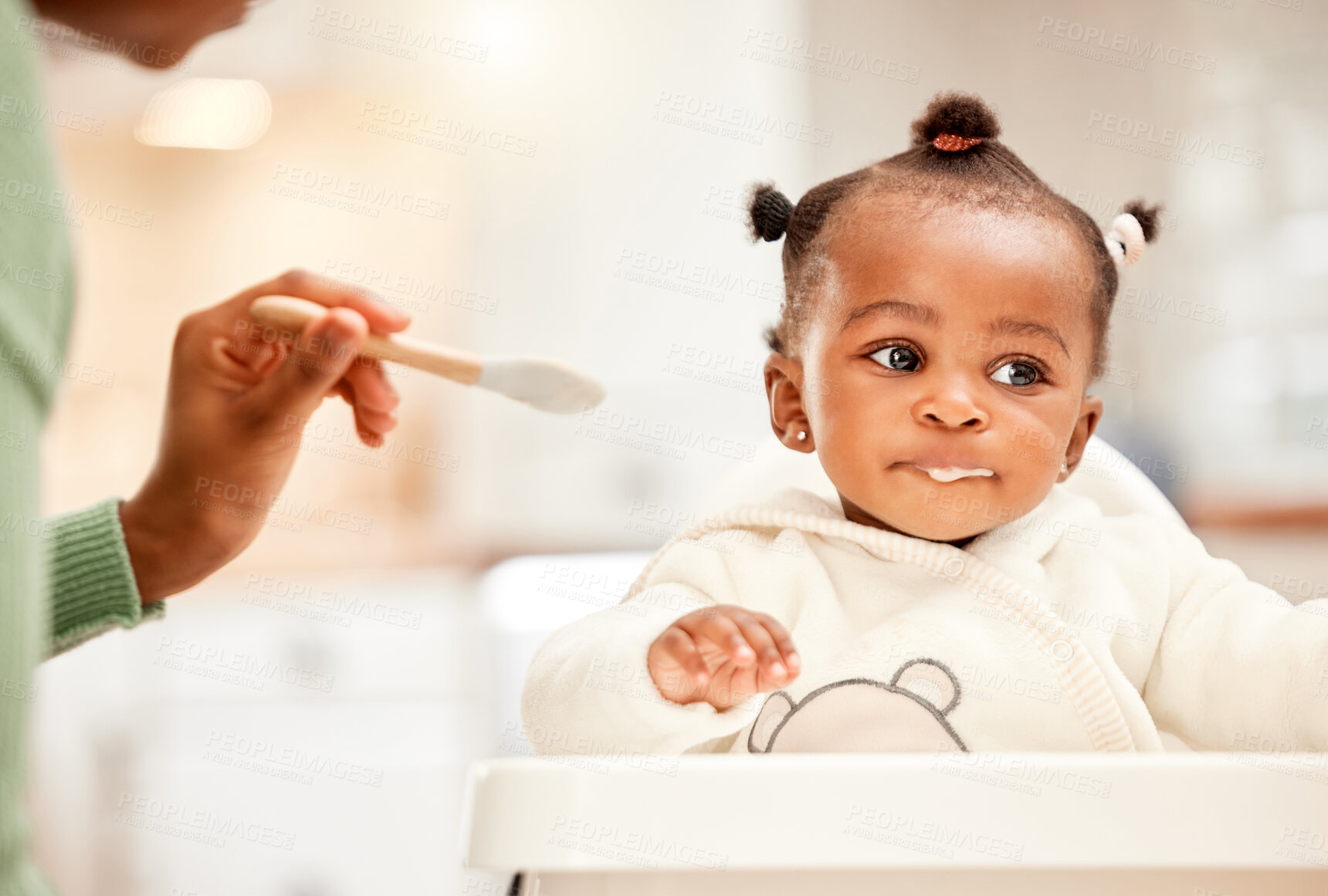 Buy stock photo Baby, hands of mom and feeding chair in kitchen for nutrition, growth or support in home. Food, child or parent in morning for breakfast, routine or hungry with meal for development, care or health