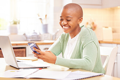 Buy stock photo Shot of a young woman using her smartphone while working from home
