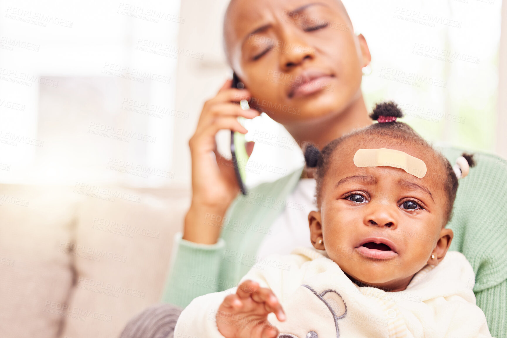 Buy stock photo Phone call, crying and mother with baby in home with stress for injury, hurt or sick child. Telehealth, medical emergency and portrait of sad kid with African mom on mobile conversation at house.