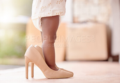 Buy stock photo Closeup, baby and girl with high heels shoes in home for childhood growth, toddler and adorable kid. Legs, infant and feet of little child in big footwear for pretend playing, development and walking