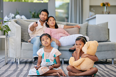 Buy stock photo Weekend, parents and kids in living room watching tv, relax and bonding together in smart home. Mom, dad and girl children on sofa with tablet, movies and online streaming subscription in Indonesia.