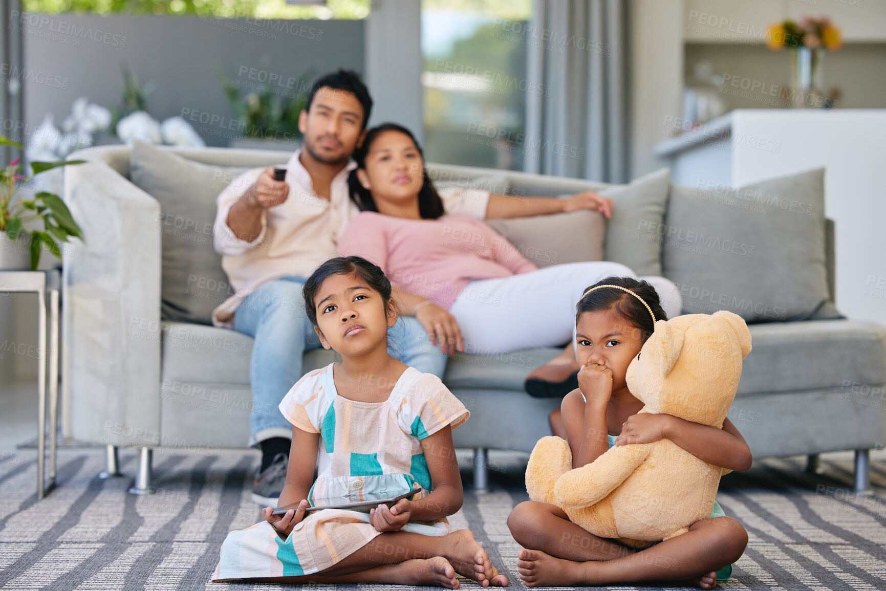 Buy stock photo Weekend, parents and kids in living room watching tv, relax and bonding together in smart home. Mom, dad and girl children on sofa with tablet, movies and online streaming subscription in Indonesia.