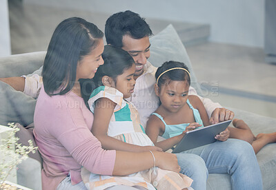 Buy stock photo Technology, parents and children on couch with tablet, internet and relax together in living room. Mom, dad and girl kids on sofa with digital app for streaming, games and online connectivity in home