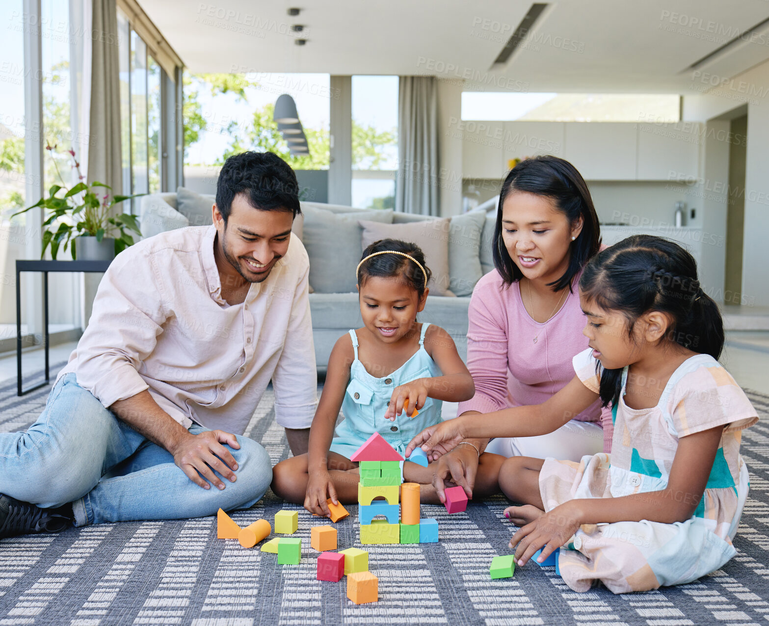 Buy stock photo Mother, father and children playing with building blocks in for game on home carpet, support or bonding. Man, woman and daughter for family connection with development in house, education or learning