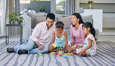 Buy stock photo Parents, children and playing with building blocks in home on carpet for support, bonding or games. Mother, father and daughter for family connection with development in house, education or learning