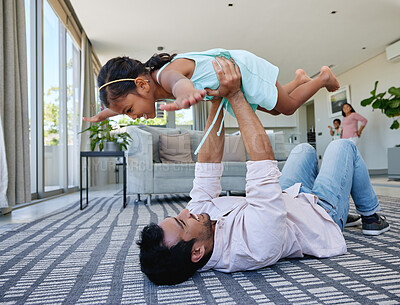 Buy stock photo Dad, girl and happy with playing on floor for support, love and growth or child development. Parent, kid and lifting at home with for bonding, childhood memories and fun together in living room