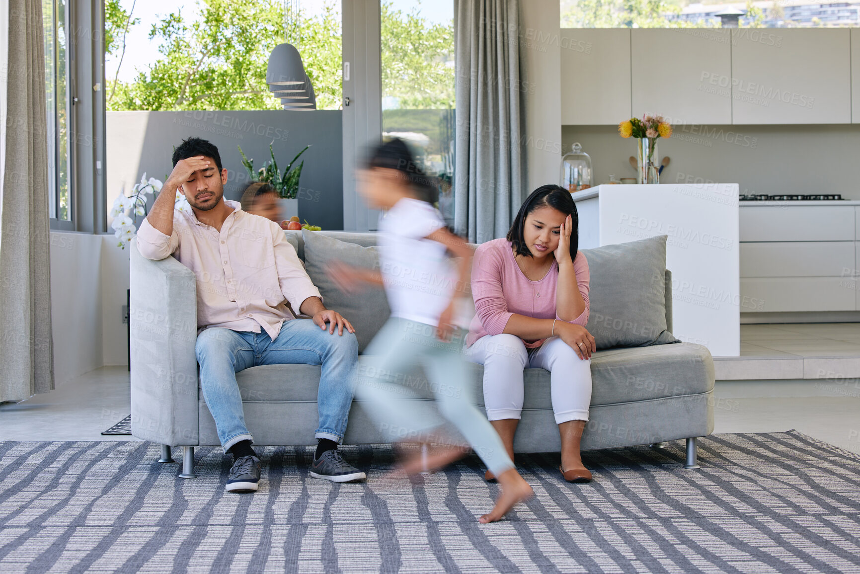 Buy stock photo Parents, children and motion blur with stress in home for adhd or hyper, tired or burnout. Mexican family, kids and running in living room with energy or mental health on sofa, anxiety or playing