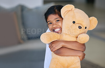 Buy stock photo Child, girl and teddy bear with hug in home, having fun and bonding with stuffed toy gift. Support, care and love of childhood playing with kid portrait and smile with sofa in house living room