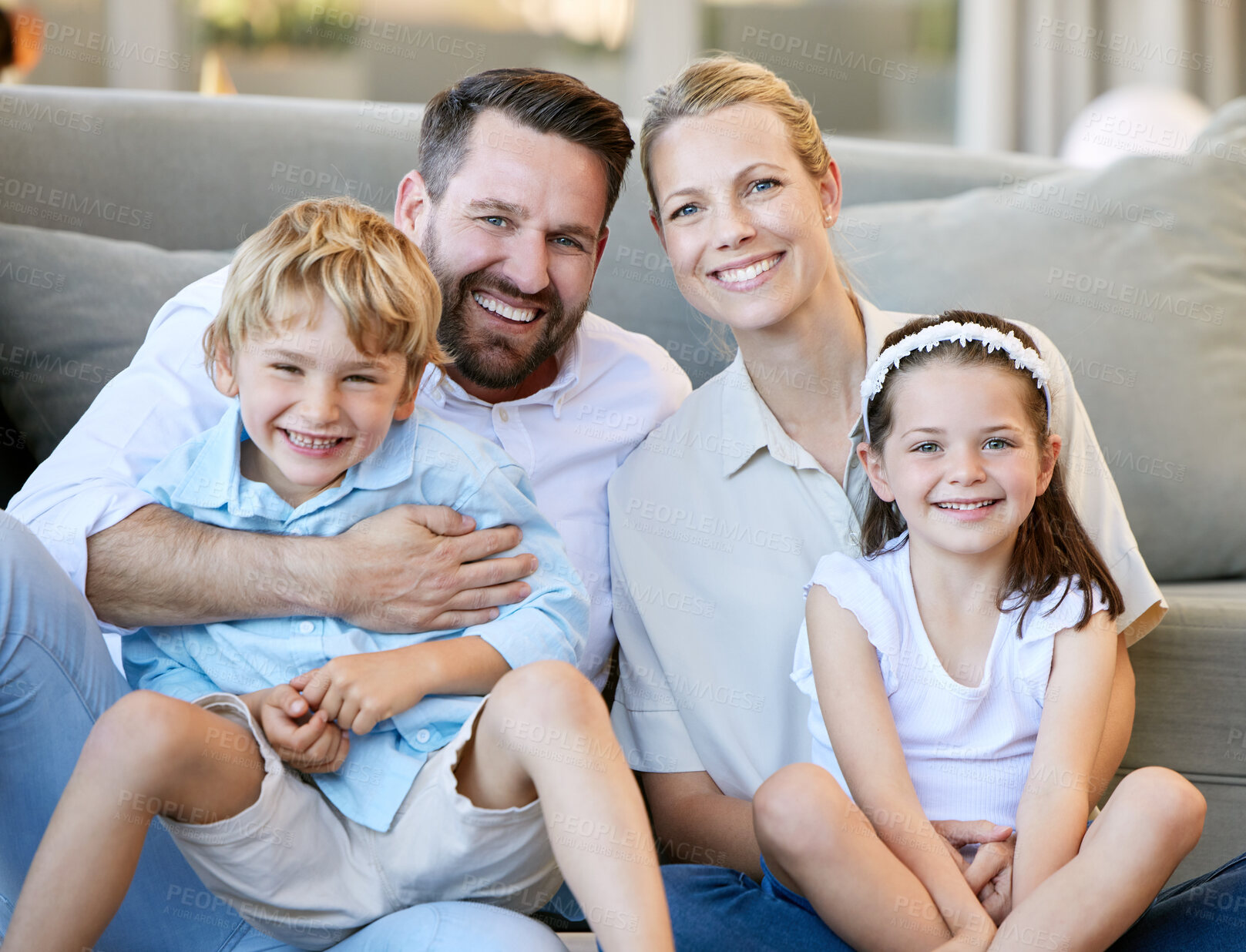 Buy stock photo Family, sofa and happy portrait in living room, children and parents in apartment for bonding and development. Smile, together and embrace for quality time, comfort and lounge for love and care
