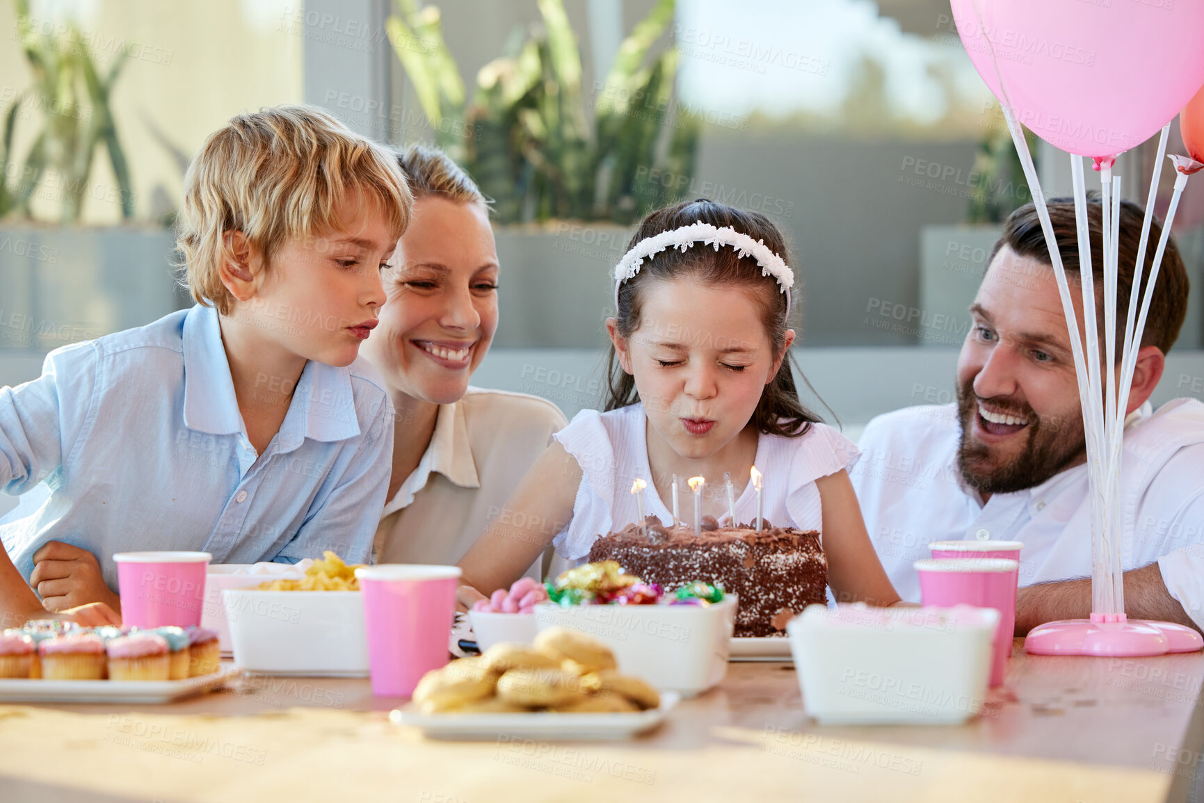 Buy stock photo Girl, party and wow with birthday cake, happy and surprise celebration in Germany or blow candles. Child, smile and love or homemade chocolate dessert on table, excited and support or family dinner