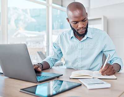 Buy stock photo Writing, typing and black businessman multitask in office, workspace or professional for work in corporate career. Productivity, employee and laptop or notebook for planning, agenda and communication