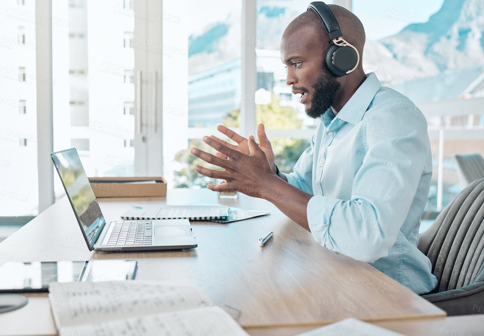 Buy stock photo Black man, headphones and virtual call on laptop in office, webinar meeting and video conference. Person, talking and internet or online app for conversation, company seminar and speaking to contact