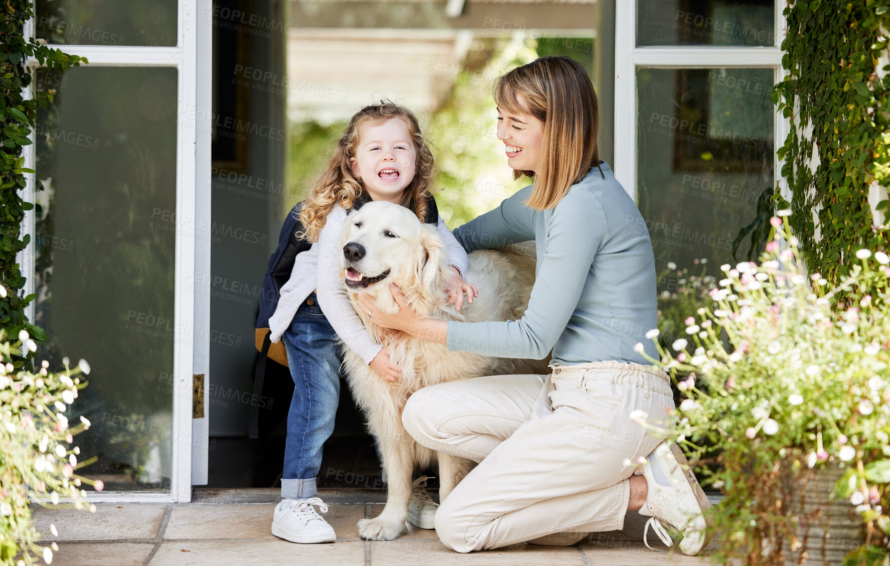 Buy stock photo Mom, dog and girl in backyard with backpack, smile and playful bonding with animal on school morning. Mother, daughter and Labrador pet in home garden with embrace, love and kiss for kindergarten kid