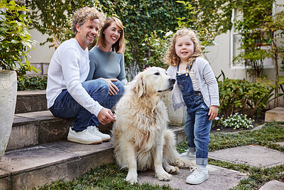 Buy stock photo Portrait of a beautiful family playing with their dog while sitting outside together