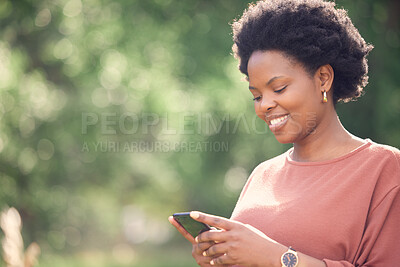 Buy stock photo Shot of a young woman using her cellphone outdoors