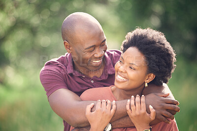 Buy stock photo Black couple, happy and hug outdoor in park with love for relationship, romance and commitment. Smiling, man and woman embrace in nature for relaxing, dating fun and bonding on weekend adventure