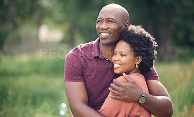 Buy stock photo Shot of an affectionate couple spending time together outdoors