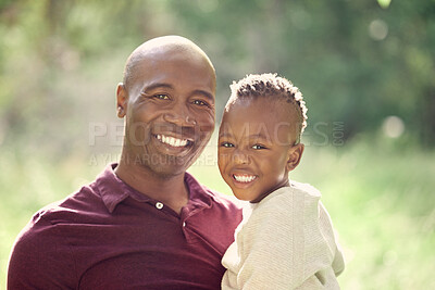 Buy stock photo Shot of a man spending the day outdoors with his son