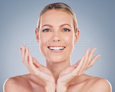 Buy stock photo Beauty, smile and portrait of woman in studio for facial, cosmetics and natural makeup. Self care, wellness and mockup with face of female model on grey background for glow, happiness and collagen