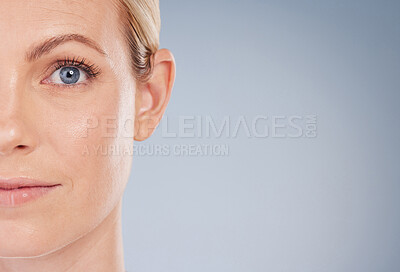 Buy stock photo Studio portrait of an attractive young woman posing against a grey background