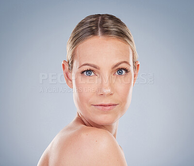 Buy stock photo Studio, face and woman in portrait for care, healthy skin and wellness with cosmetics. Mockup, female model and natural glow with daily routine, treatment results and benefits by gray background