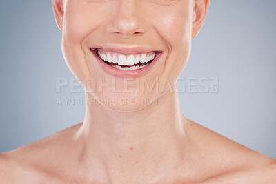 Buy stock photo Mouth, teeth and smile of woman closeup in studio for dental care, oral hygiene and healthy gums. Female model, wellness and veneers for confidence, pride and whitening of tooth by gray backgrounds