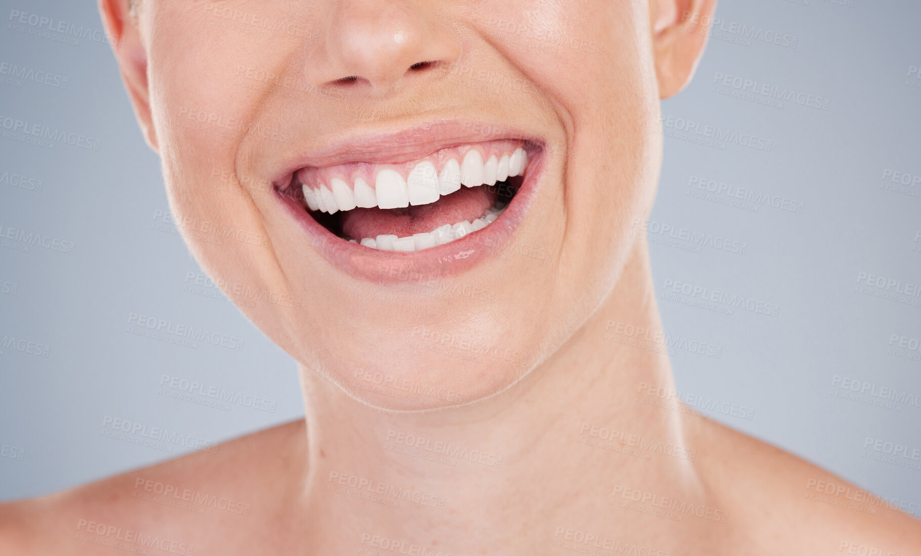 Buy stock photo Mouth, teeth and laugh of woman closeup in studio for dental care, oral hygiene and healthy gums. Female model, wellness and veneers for confidence, pride and whitening of tooth by gray backgrounds